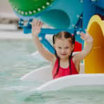a-child-plays-in-a-water-park-a-little-girl-is-ha-2025-02-21-22-56-49-utc