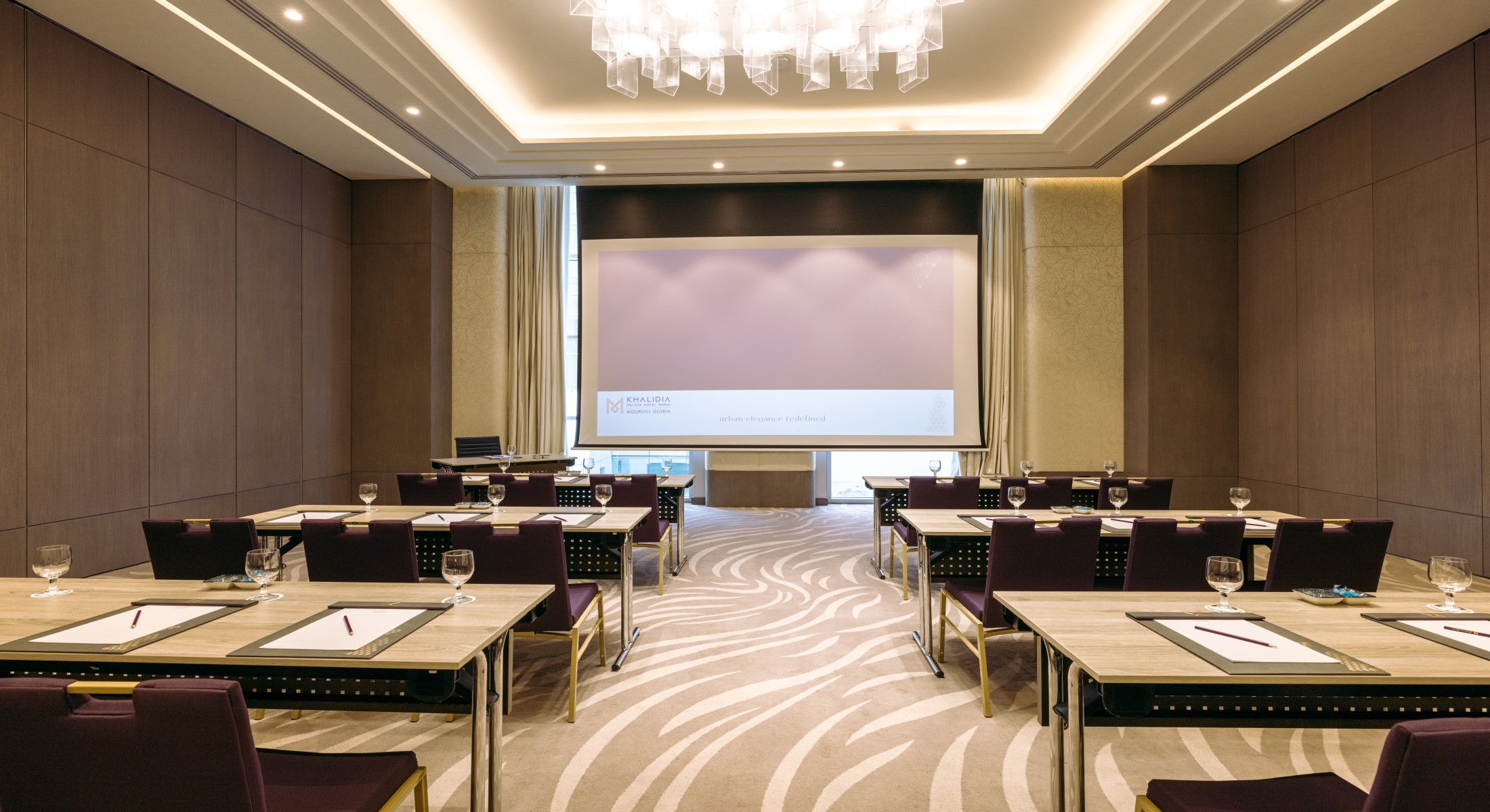 Theatre-style seating in a conference room at Khalidia Palace Hotel Dubai, perfect for seminars and presentations.