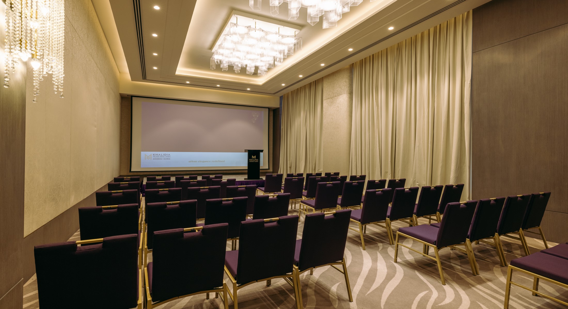 Theatre-style seating in a conference room at Khalidia Palace Hotel Dubai, perfect for seminars and presentations.